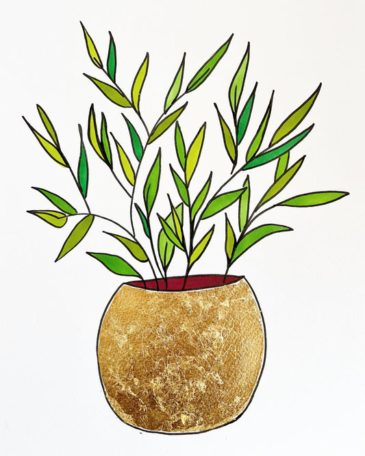 Gold vase and green leaves